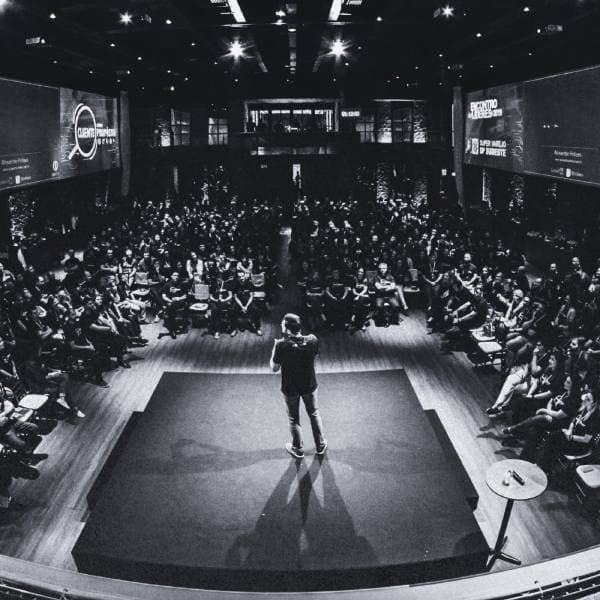 Large audience hall at a private mastermind event